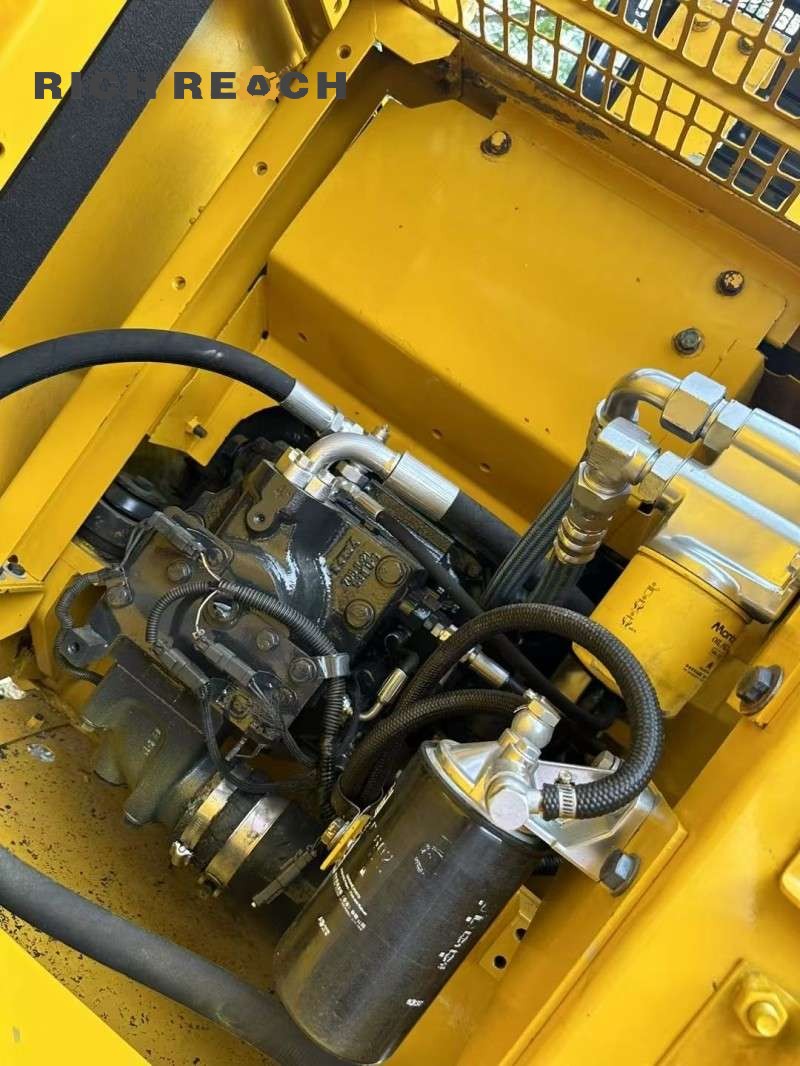 Close-up of tracks and sprocket on a 2023 Komatsu PC130-8 excavator, 500 hours, $16,667